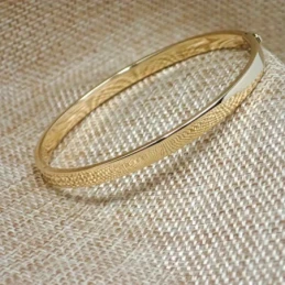 Pulsea rígida oro 18k brazalete mujer 60 mm. media caña lisa ancho 5