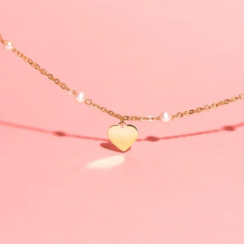 Pulsera Oro 18k chapa corazón 10 mm. perlas 3.5 mm. cadena forzada 15