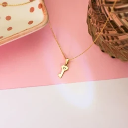 Colgante Oro 18k mujer 14 mm. forma llave circonita centro lisa