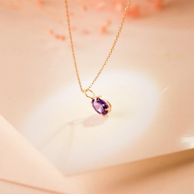 Colgante Oro 18k mujer 7 mm. piedra color amatista ovalada garras