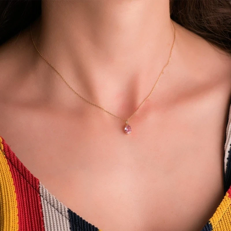 Colgante Oro 18k mujer 7 mm. piedra color rosa ovalada garras