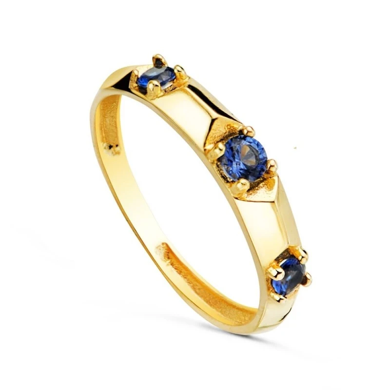 Sortija Oro 18k mujer tres circonitas color azul garras ancho cuerpo
