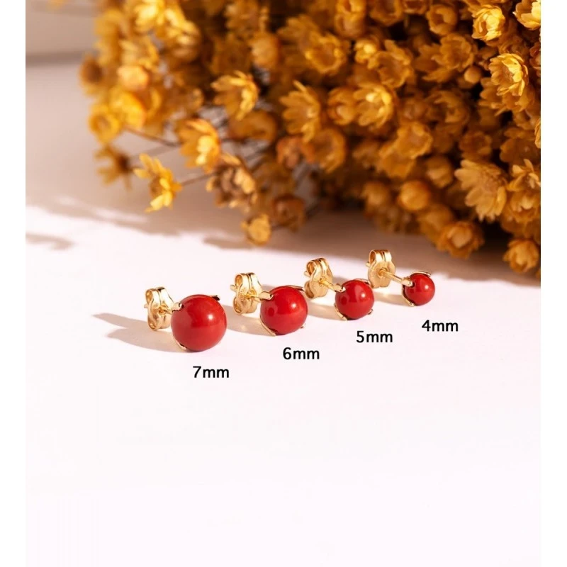 Pendientes en Oro de 18k con piedra coral de 6 mm. con garras
