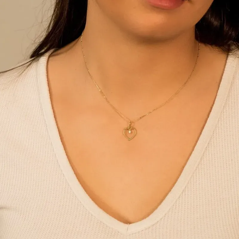 Colgante oro 18k mujer 13 mm. calado liso circonita centro 2 mm.