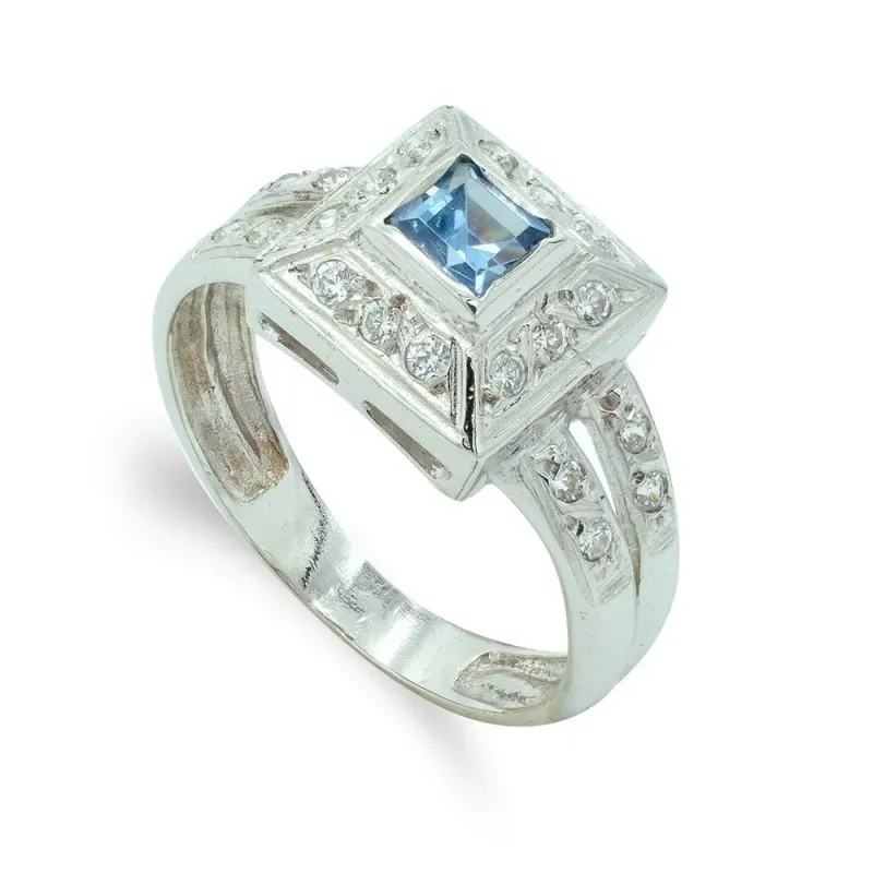 Sortija oro blanco 18k mujer cabeza cuadrada piedra azul centro combi