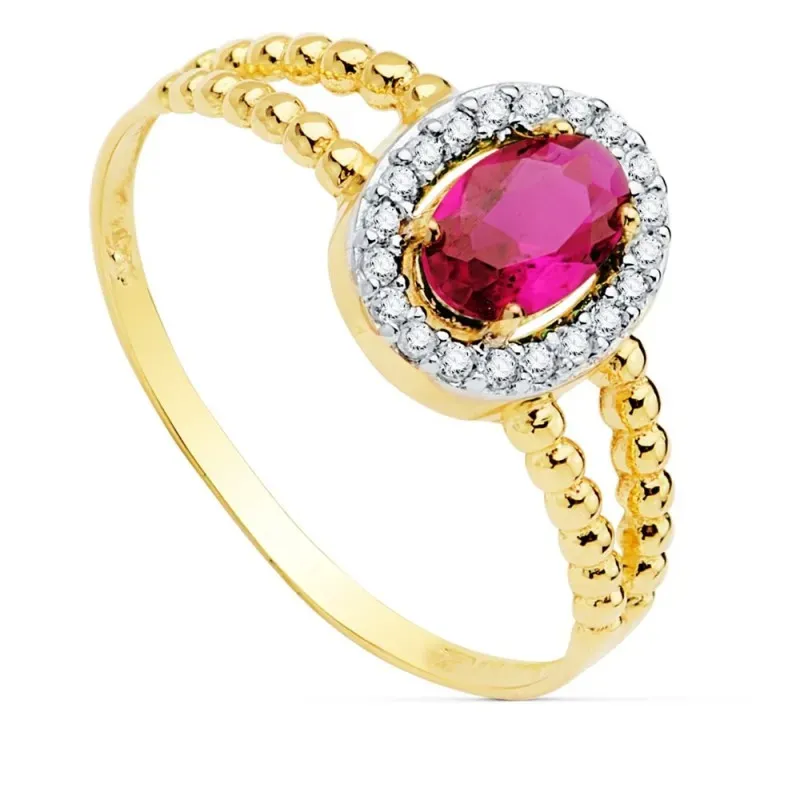 Sortija oro bicolor 18k mujer centro piedra roja 6x4mm. cerco circonitas laterales bandas