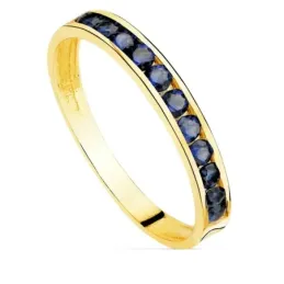 Sortija oro 18k centro carril circonitas azules oscuras cuerpo liso