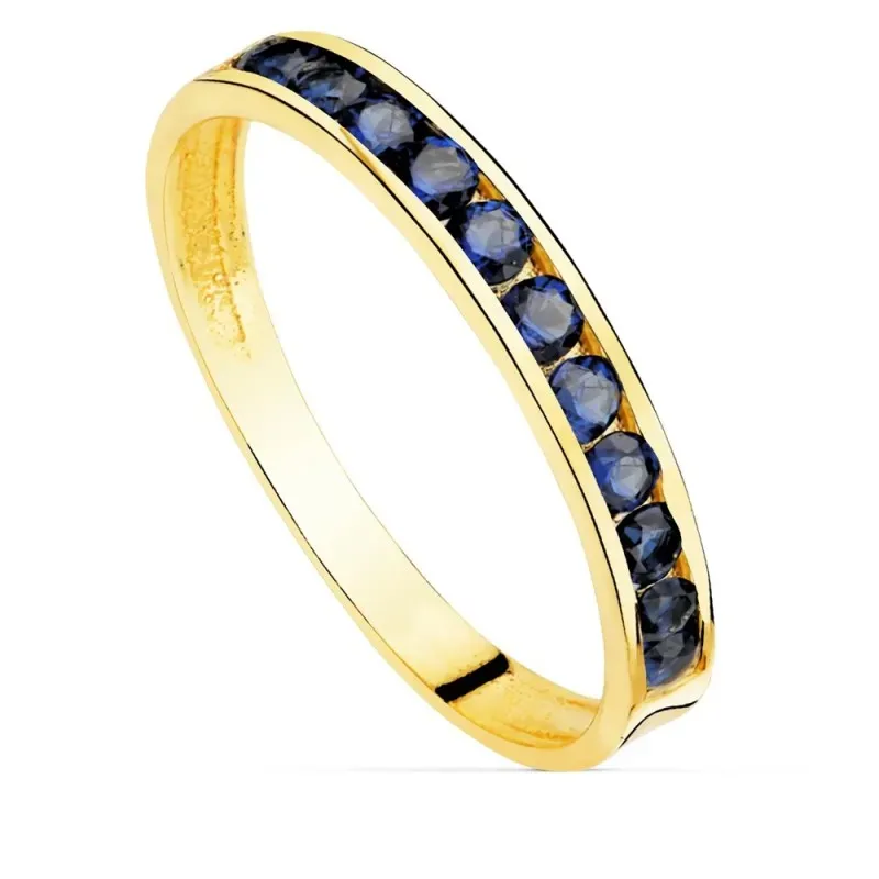 Sortija oro 18k centro carril circonitas azules oscuras cuerpo liso