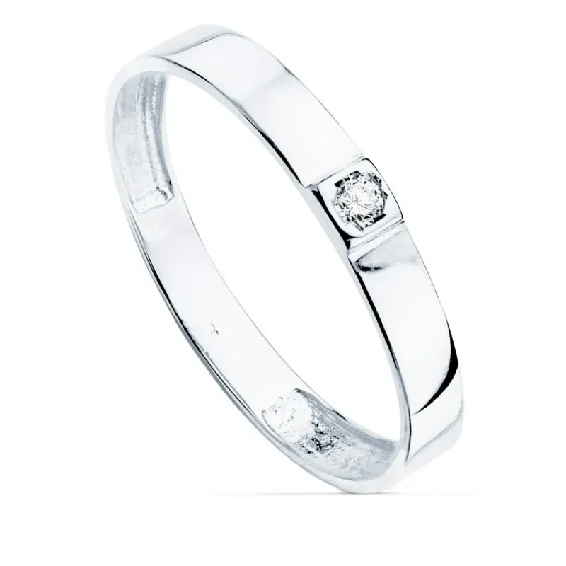 Sortija oro blanco 18k centro una circonita cuerpo 3mm. liso