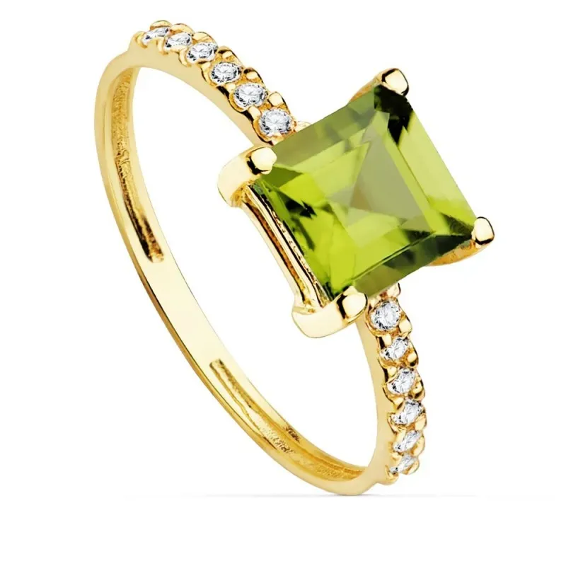 Sortija oro 18k centro piedra peridoto fino 6x6mm. cuerpo detalle circonitas