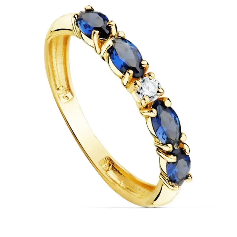 Sortija oro 18k circonitas azules talla marquise centro blanca cuerpo 2.5mm. liso