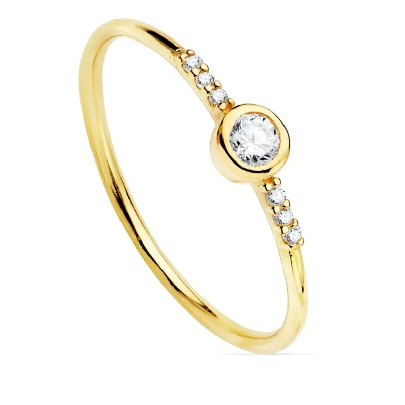 Sortija oro 18k estilo soliario diamantes billantes 0.14ct. cuerpo liso