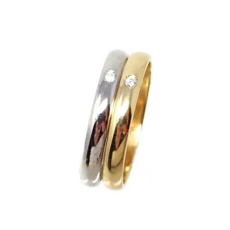 Alianza oro bicolor 18k dos brillantes 0.032ct. diámetro 2mm. Ancho 3
