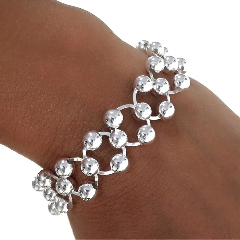 Pulsera plata Ley 925m 20cm. eslabones asas planas redondas bolas 6mm. entrelazadas cierre mosquetón