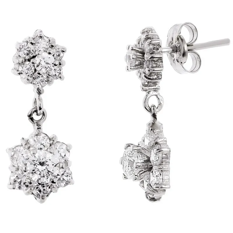 Pendientes oro blanco 18k largos 19mm. flor cuajo circonitas garras c