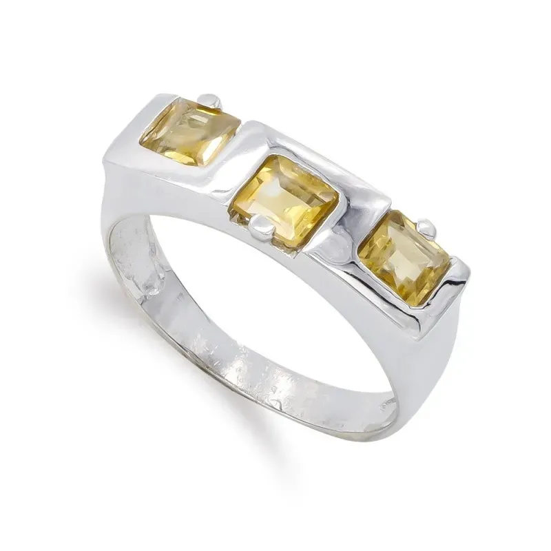 Sortija oro blanco 18k mujer topacio 3,5 mm. tres piedras
