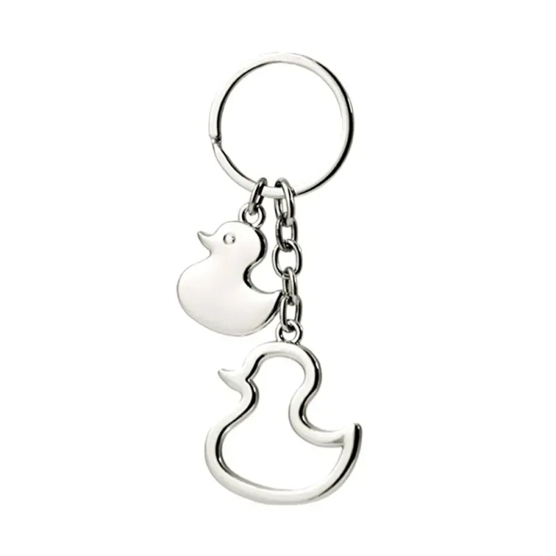 Llavero metálico forma pato 10 cm. doble calado combinado liso
