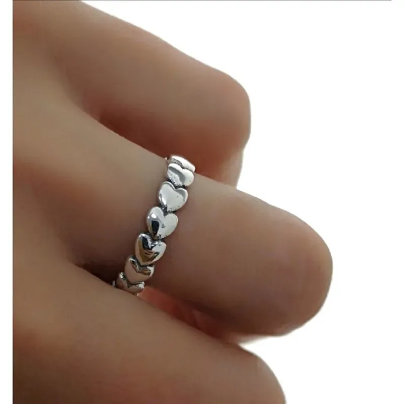 Sortija plata Ley 925m. mujer lisa cuerpo corazones oxidados continuados