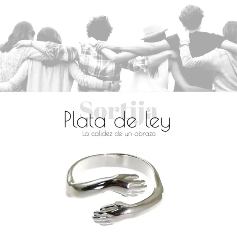 Sortija plata Ley 925m 4mm. forma abrazo manos cruzadas lisa abierta