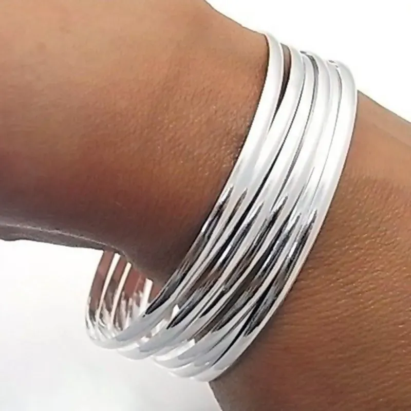 Pulsera aro plata Ley 925m mujer semanario media caña liso 7 aros diámetro 60mm. ancho 3mm.