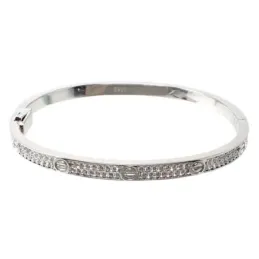 Brazalete plata Ley 925m terminación rodio liso detalles dibujo tornillo circonitas