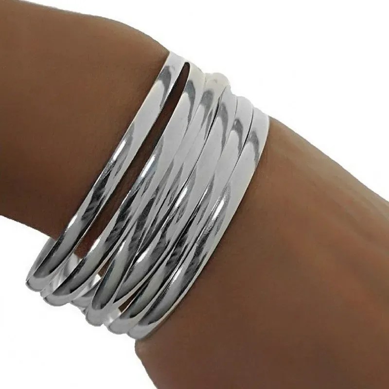 Pulsera aro plata Ley 925m mujer semanario media caña liso 7 aros diámetro 60mm. ancho 4mm.
