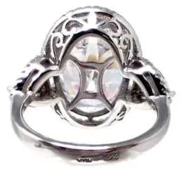 Sortija plata Ley 925m terminación rodio circonitas central oval 18x13mm. lateral lágrimas cerco