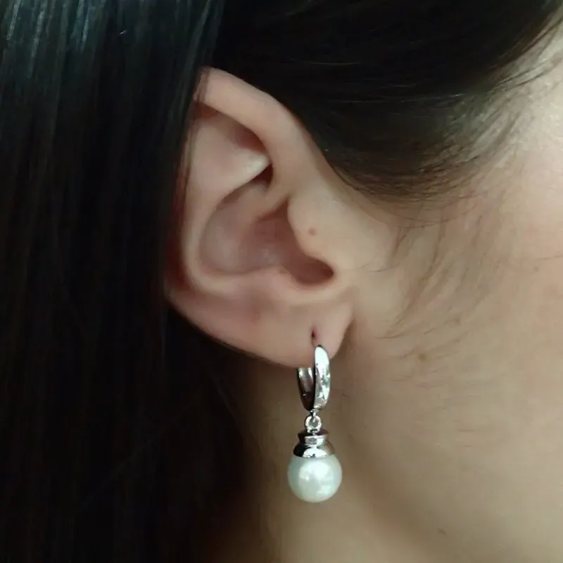 Pendientes plata Ley 925m terminación rodio 32mm. aros perla sintética colgando