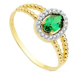 Sortija oro bicolor 18k mujer centro piedra verde 6x4mm. cerco circonitas laterales bandas