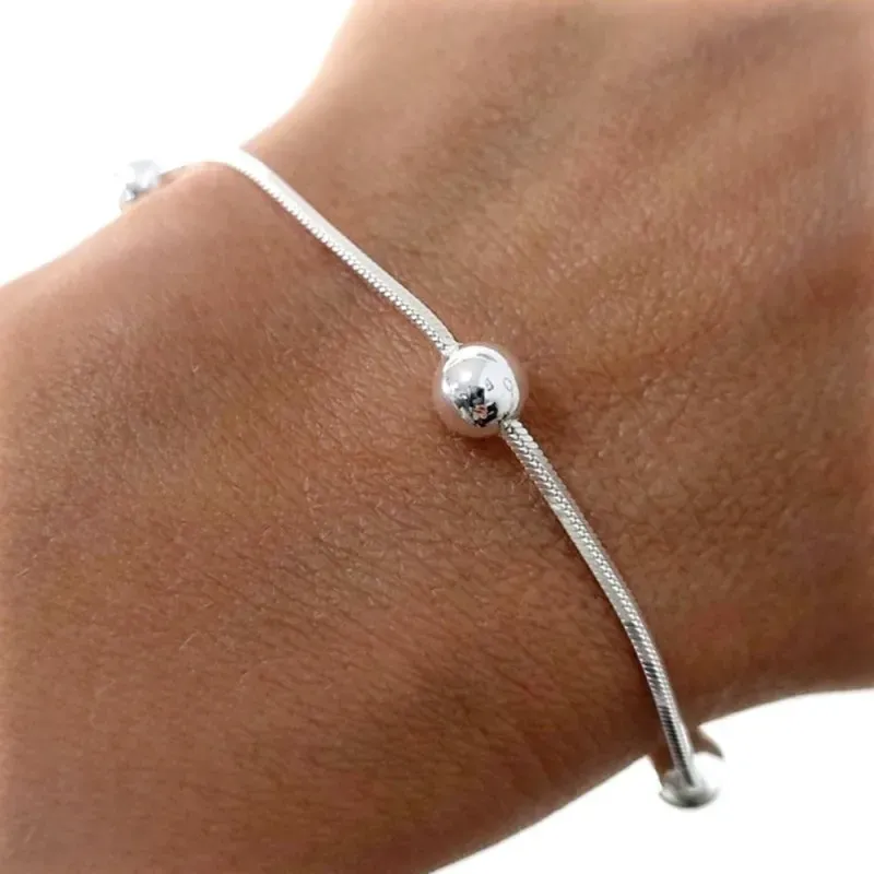 Pulsera en Plata Ley 925m de 17.5 cm. cola detopo de 1 mm. bolas lisa