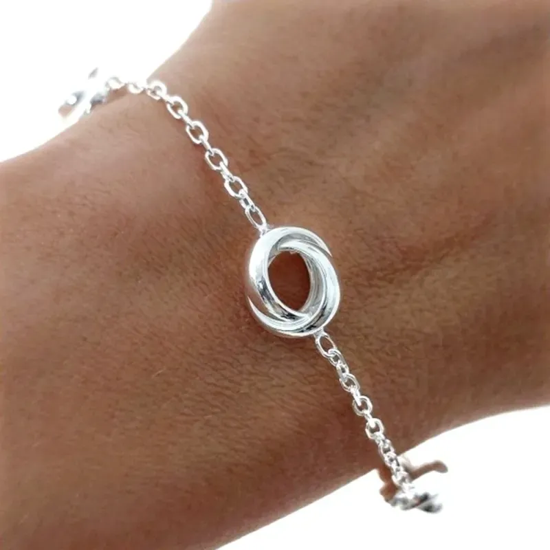 Pulsera Plata de Ley 925m con 17.5 cm. cadena forzada con aros entrel