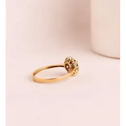 Sortija en Oro de 18k con zafiro difusión 5 mm. con 0.56ct. 12 diaman