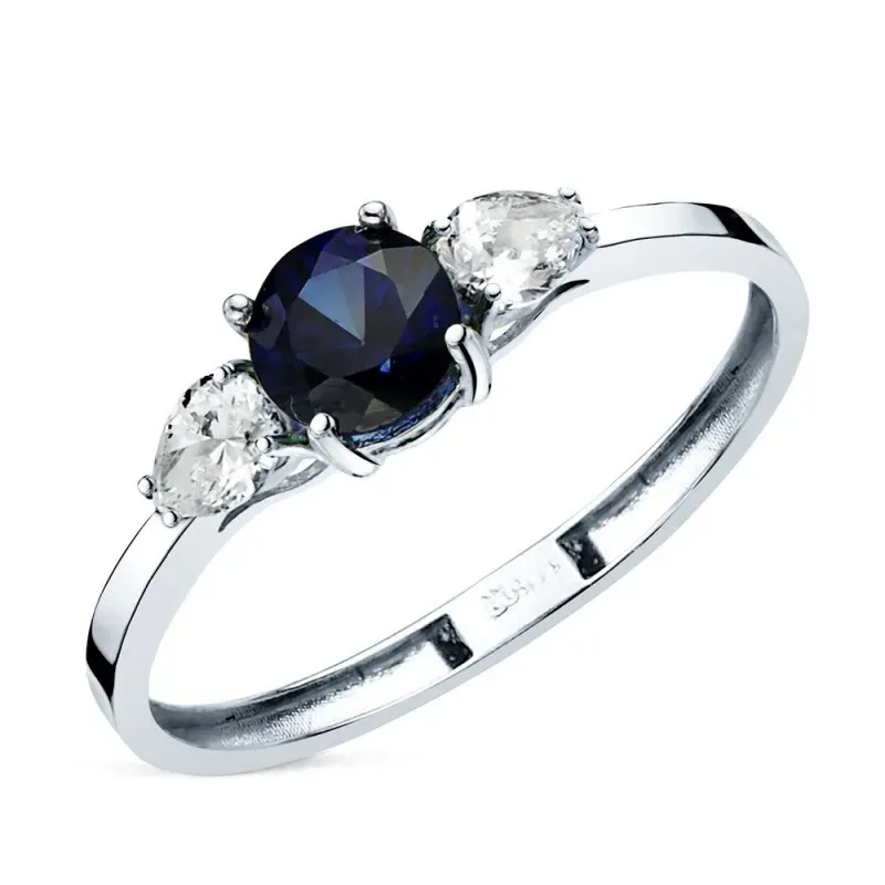 Sortija Oro Blanco de 18k zafiro natural 5 mm. 0.63ct. dos diamantes