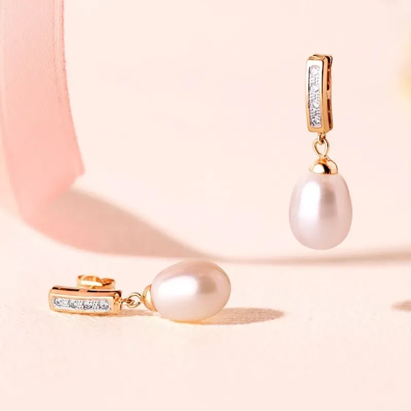 Pendientes en Oro Bicolor de 18k con 25 mm. perla forma pera circonit