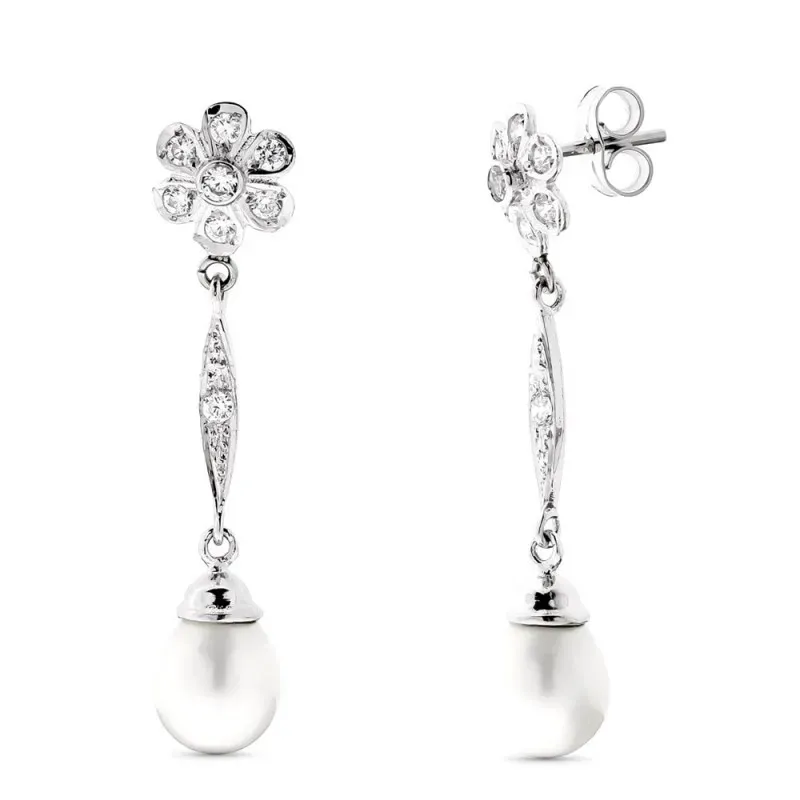 Pendientes Largos en Oro Blanco 18k forma flor con circonitas combina