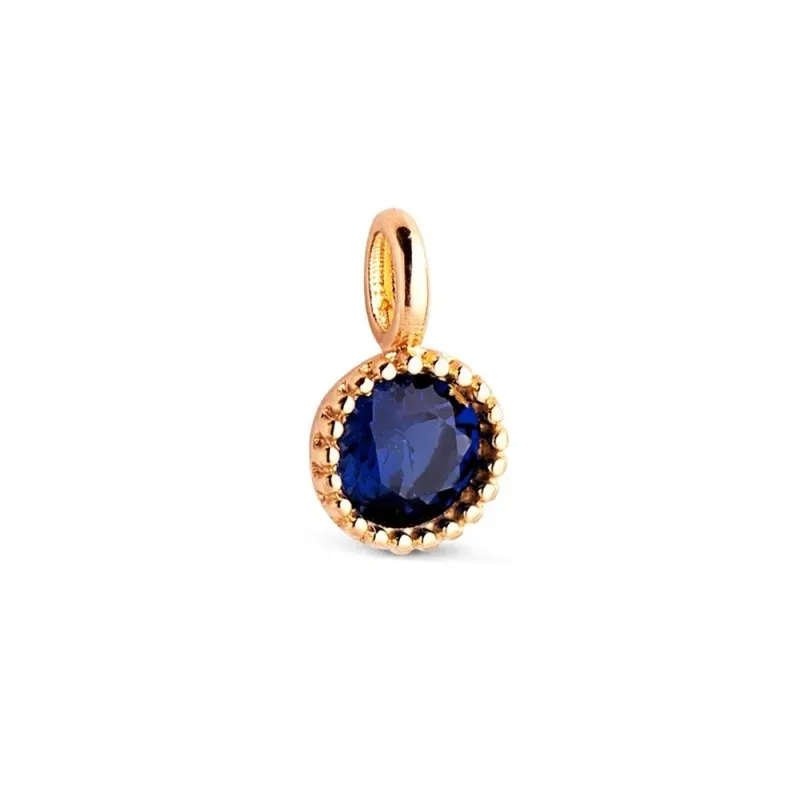 Colgante en Oro de 18k con 5.5 mm. piedra azul en el centro borde det
