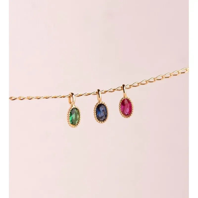 Colgante en Oro 18k de 9 mm. ovalado con piedra verde en el centro de