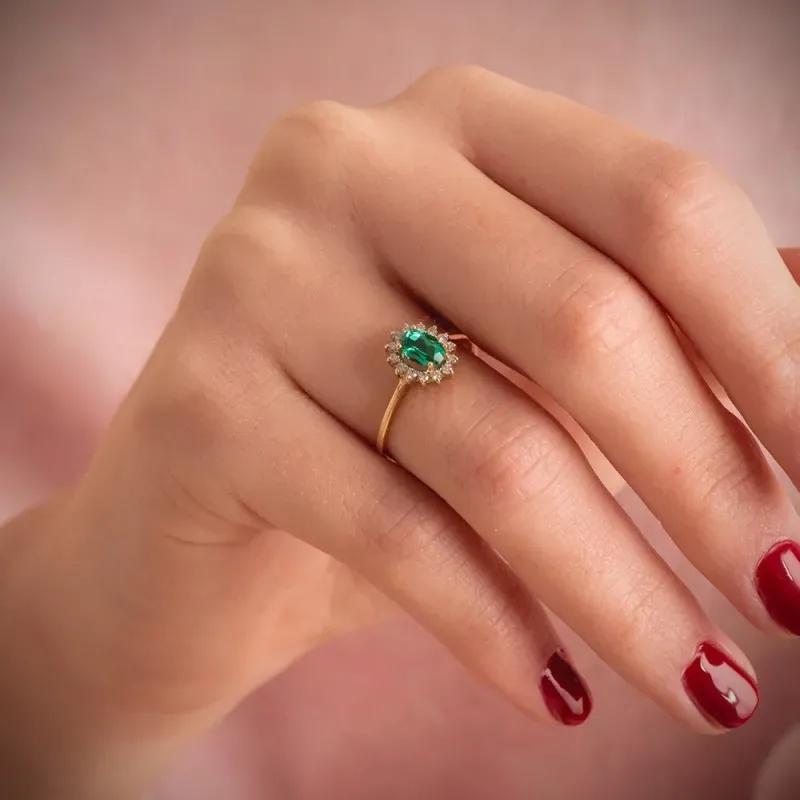 Sortija Oro 18k mujer esmeralda centro 0.039ct. combinada 14 diamante