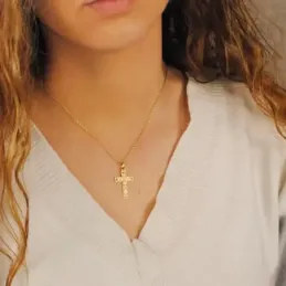 Crucifijo oro 18k Cristo cruz 27 mm. centro lisa bordes tallados esqu