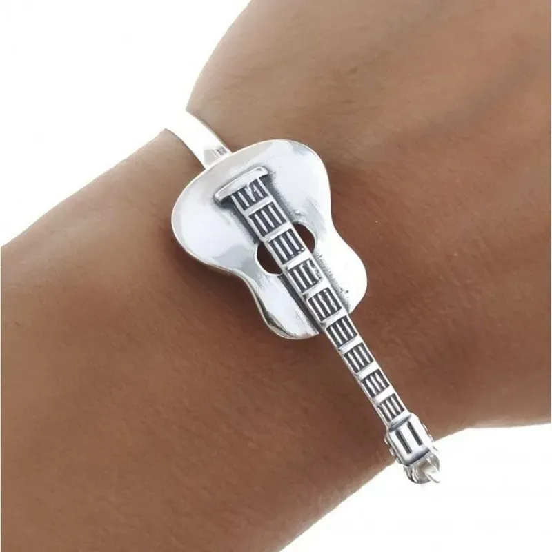 Pulsera plata Ley 925m. mujer rígida motivo guitarra oxidada calada