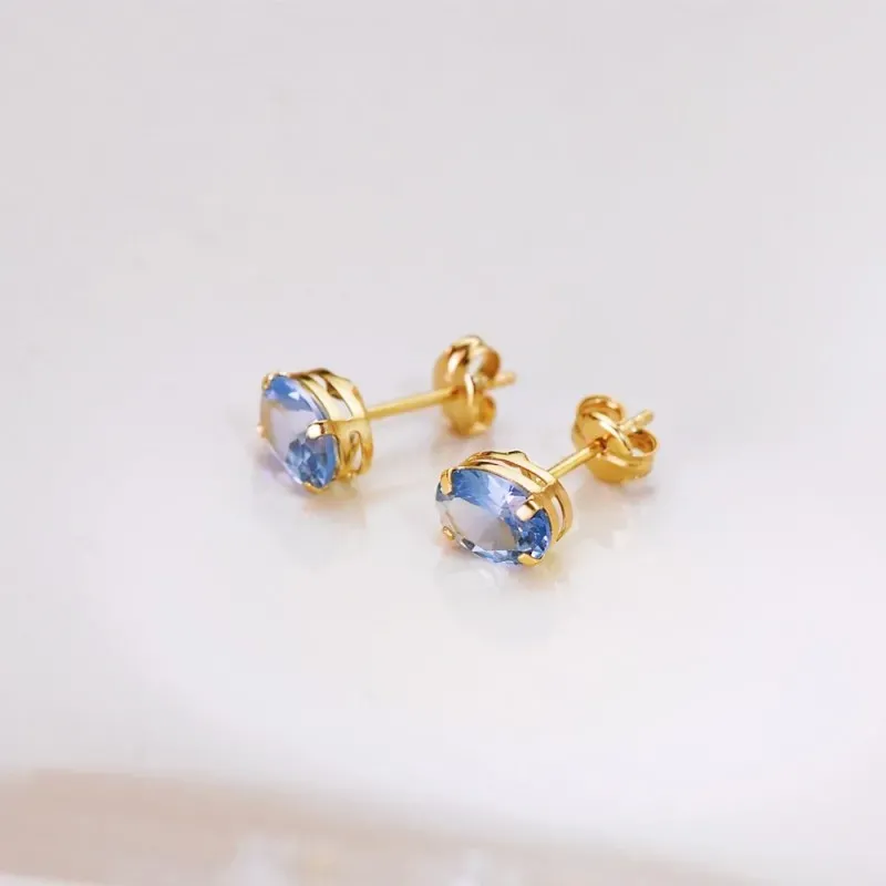 Pendientes Oro 18k mujer 7 mm. piedra azul ovalada
