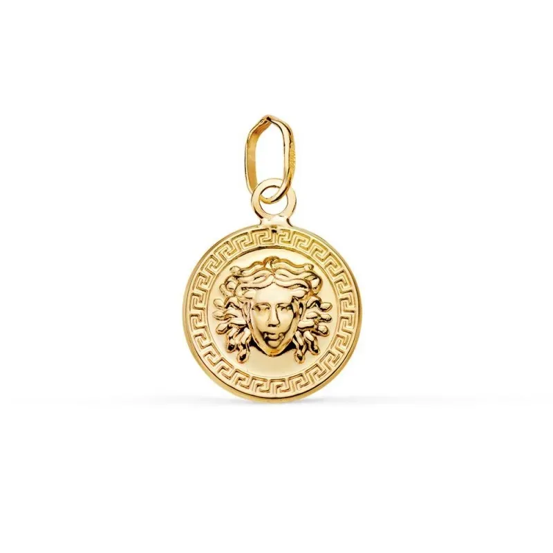 Colgante en Oro de 18k con 12 mm. y medusa en el centro con un detall