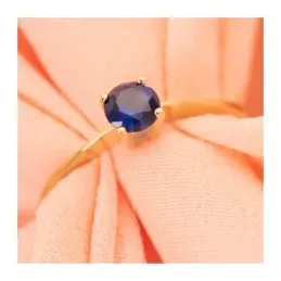 Solitario en Oro de 18k con circonita de color azul con 5 mm. garras