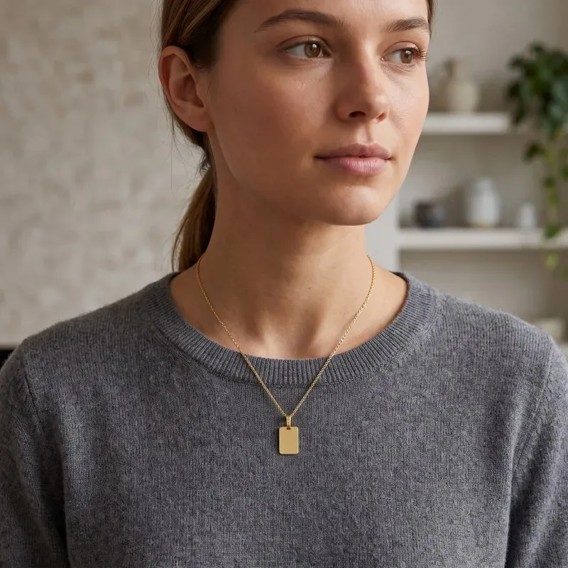 Colgante oro 9k unisex 17 mm. chapa rectangular lisa brillo
